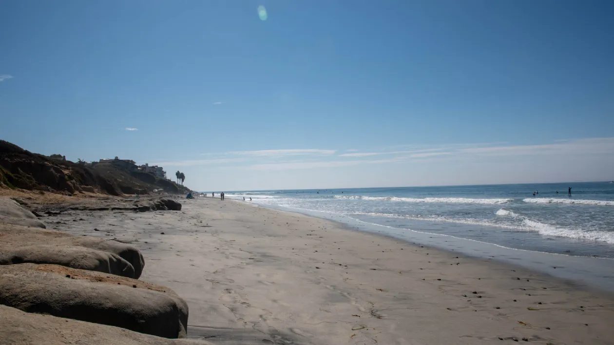 Beachgoers and Surfers at Warm Water Jetty Beach