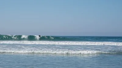 Surfer Catching a Wave at Del Mar City Beach