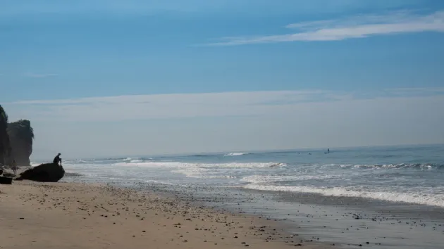 Sitting on a Rock Checking Out the Surf