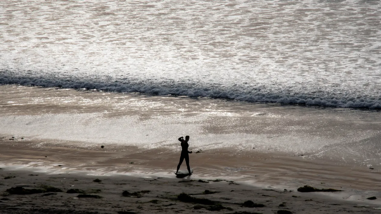 Surfer Getting Ready to Go Out at North Pacific Beach