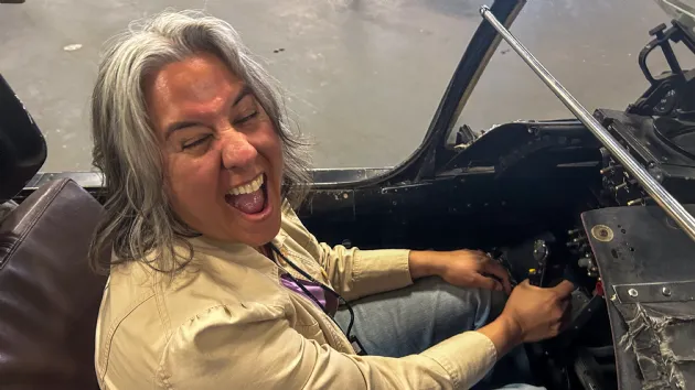 Erika in a Fighter Plane Cockpit on the USS Midway