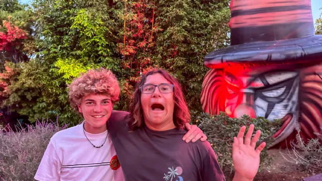 Lucas and Buddy Ready to Be Scared at Howl O Scream Sign at Seaworld San Diego