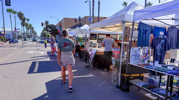 Erika Exploring the Vendors at the Pacific Beachfest