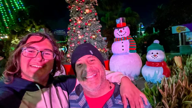 Todd and His Son Having Fun at Seaworld Christmas Celebration