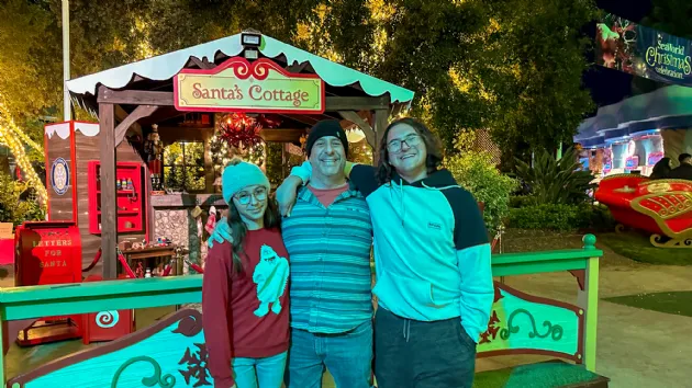Todd and Kids in Front of Santas Cottage at Seaworld Christmas Celebration