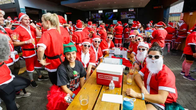 Relaxing with a Beer After the San Diego Santa Run
