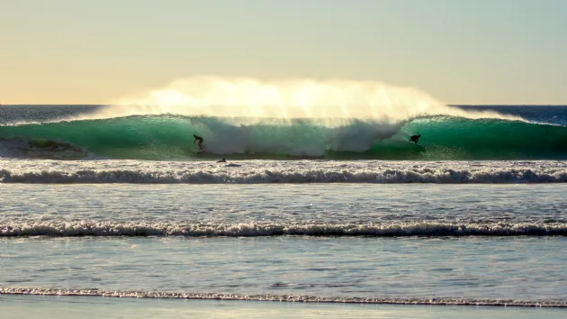 Two Surfers in a Barrel at Blacks Beach