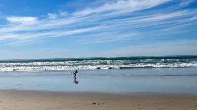 Little Girl Playing on the Beach in Pb